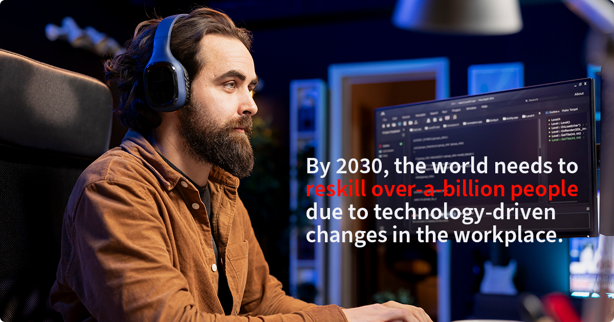 A man with a beard and headphones is looking at a computer screen displaying code. Text overlaid on the image reads, "By 2030, the world needs to reskill over-a-billion people due to technology-driven changes in the workplace."